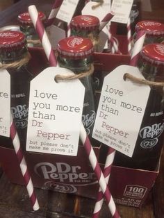 some bottles with red and white striped straws in them are labeled love you more than dr pepper