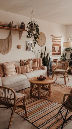 a living room filled with lots of furniture next to a wall mounted potted plant