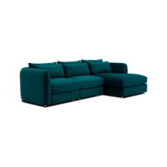 a green sectional sofa with pillows on the top and bottom, in front of a white background