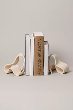 two bookends made out of books sitting on top of each other