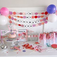 a birthday party with balloons and decorations