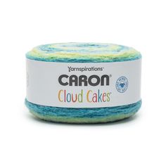 yarn that is blue and yellow with the words carbon cloud cakes on it in front of a