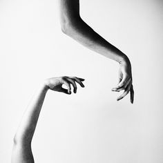 two hands reaching towards each other with the words flow above them in black and white