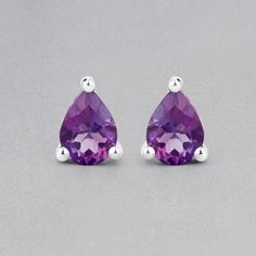 "Amethyst Stud Earrings, Natural Amethyst Pear Shape Stud Earrings, Bridesmaid Gifts, Purple Gem Earrings, February Birthstone Earrings Flaunt yourself with these amethyst stud earrings. The natural gemstones have a combined weight of 1.25  carats and are set in .925 sterling silver with rhodium plating. The purple hue of these earrings adds a pop of color to any look!  The understated design and vibrant stones make these earrings perfect for every occasion. .925 Sterling Silver Stone Details: A Blue Topaz Jewelry, Amethyst Studs, Purple Gems, Gem Earrings, Birthstone Earrings, Earrings Bridesmaid, Aquamarine Jewelry, Silver Gemstone Jewelry, Amethyst Jewelry