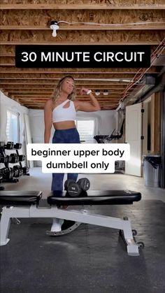 a woman standing on top of a bench in a gym with the text 30 minute circuit beginner upper body dumbbell only