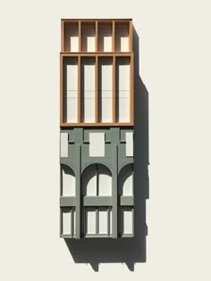 an architectural model of a building with arched windows and wooden slats on the side