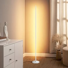 a white floor lamp in a living room