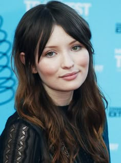 a close up of a person with long hair