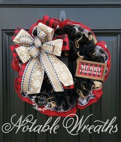 a red and black christmas wreath with a merry sign hanging on the front door,