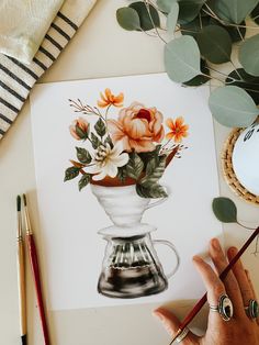 a person is painting flowers in a vase