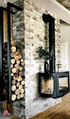 a fireplace with logs stacked on top of it