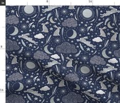 an image of a blue and white fabric with stars, clouds, and rabbits on it