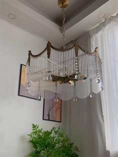 a chandelier hanging from the ceiling in a living room