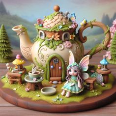 a figurine is sitting on a table with a teapot in the shape of a house