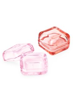 three pink glass dishes sitting next to each other