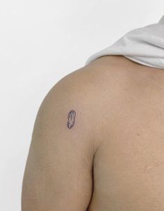 a man with a small tattoo on his back