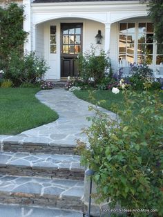 a house with stone steps leading to the front door