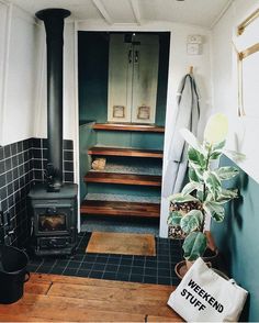 there is a potted plant next to the stairs in this bathroom with blue tiles