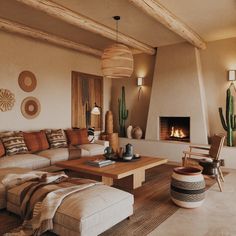 a living room filled with furniture and a fire place