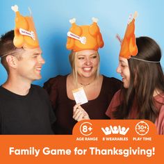 three people wearing orange hats with the words family game for thanksgiving written on them in white