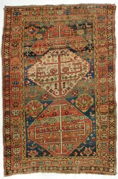 an old rug with many different colors and patterns