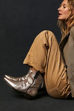 Your new go-to boot all season long, these western-inspired leather boots from our We The Free collection are featured in a short silhouette with square pointed toe and contrast sole for added dimension. * Back zip closure * Hand-stitched detailing throughout * Unique studded bottom sole * Specially designed side tabs **Fit tip:** This style runs true to size, if in between sizes; we suggest sizing up. **Please Note:** The leather is hand finished and each pair of boots is unique, what you recei Boots And Shorts, Western Ankle Boots Outfit, Western Fashion Editorial, Desert Fashion Editorial, Low Ankle Boots, Tall Brown Boots, Boots Outfit Ankle, Desert Fashion, Equestrian Boots