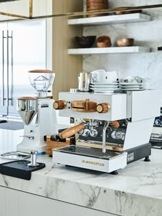 an espresso machine sitting on top of a counter