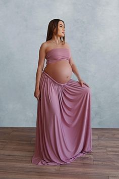 2 piece Set includes: Multiway gown and matching bandeau top Elevate your maternity fashion game with a dress that adapts to your mood and the occasion. The fabric can be artfully twisted, wrapped, and tied in multiple ways, allowing you to effortlessly switch between styles. Transform it into a chic halter neck for a breezy summer afternoon, flaunt an elegant off-shoulder look for date night, or opt for a sophisticated one-shoulder style for that special event. This styles features a matching b Two Piece Maternity Outfit Photoshoot, Split Dress Maternity Photos, Maternity Maxi Dress With Ruffles, Maxi Skirt Pregnancy Outfit, Flowy Off-shoulder Maternity Maxi Dress, Maternity Off-shoulder Maxi Dress With Ruffles, Maternity Two Piece, Baby Shower Gown, Maternity Shoot Outfit