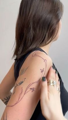 a woman with a tattoo on her arm