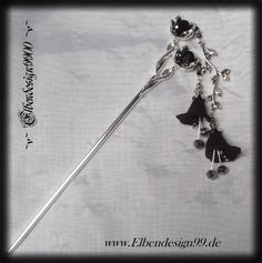 A very beautiful hair accessory in gothic style, which, like all my jewelry, was made with a lot of care and attention to detail. The hairpin was decorated with black and black diamond rhinestones. The pendants are made of black acrylic flowers with glass beads. The hairstick has a length of approx. 17 cm, the pendants approx. 9 cm. Hair Stick Design, Hair Pin Stick, Gothic Goddess, Gothic Hair Accessories, Dnd Bard, Goddess Hair, Black Hair Accessories, Gothic Hairstyles, Fashion Angels