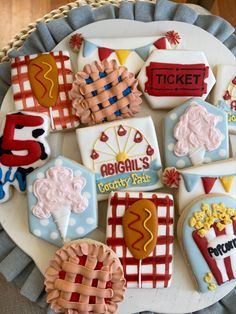 decorated cookies are arranged on a platter