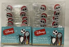 the jack and sally christmas lights are packaged in plastic bags with santa hats on them