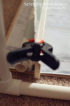 a close up view of the bottom of a window sealer on a carpeted floor