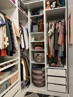 an organized closet with clothes and baskets