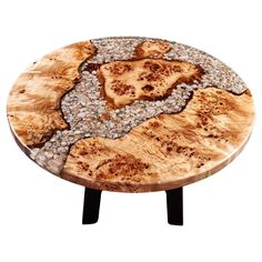 a wooden table topped with lots of rocks and pebbles on it's side legs