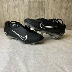 a pair of black and white nike shoes