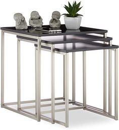 three nesting tables with black marble top and metal frame legs, one on each side