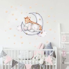 a baby crib with a teddy bear sleeping on the moon