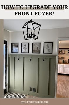 an entry way with pictures on the wall and a chandelier hanging above it