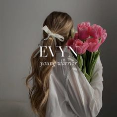 a woman holding a bunch of pink flowers with the words lynn young warrior on it