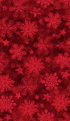 red snowflakes on a dark background with white stars and sparkles in the middle