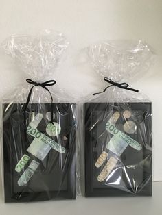 two bags with money are wrapped in plastic