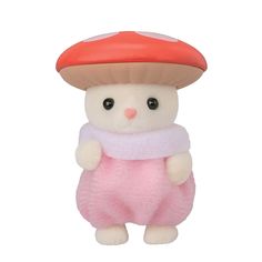 a small stuffed animal with a red mushroom on its head