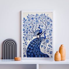 a blue and white peacock sitting on top of a shelf