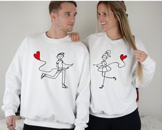 "Heart Balloon Couple Valentines Sweatshirt, Cute Matching Couples Sweater, Couple Matching Hoodie, Heart Love Couple Sweater, Valentine Gift ☀️☀️☀️☀️☀️ Everything in our shop is hand crafted and made to order. If you want different color or size contact me! If you would like something custom made to fit your personal style please message me and I will do everything to get you that something special. ---How To Order--- ⭐️Please, check and review all photos ⭐️Choose your t-shirt size and color ⭐️Enter your Design Color Example: \"White\" ⭐️Click add to cart. You can go back to add more product ⭐️Click \"Proceed to check out\" ⭐️When you check out, you can add a note to seller for any request *High quality and super soft, comfortable shirt. Made with top of the line vinyl and pressed with a Couples Matching Sweaters, Sweater Couple, Valentines Sweatshirt, Couple Hoodies, Cute Matching, Custom Printed Shirts