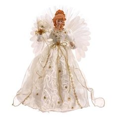 a white angel figurine with red hair and gold trimmings on it's wings