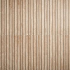 a wooden wall with vertical lines painted on the wood paneling in light brown tones