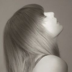 black and white photograph of a woman's head with long hair