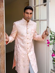 Light pink sherwani in a lucknowi embroidered fabric. This sherwani is paired with white pants. Pink Sherwani, Embroidered Fabric, Wedding Looks, White Pants, Spring Break, Custom Sizing, Light Pink, Size Chart