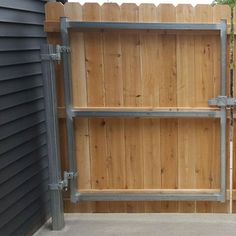 a wooden fence with metal bars on it